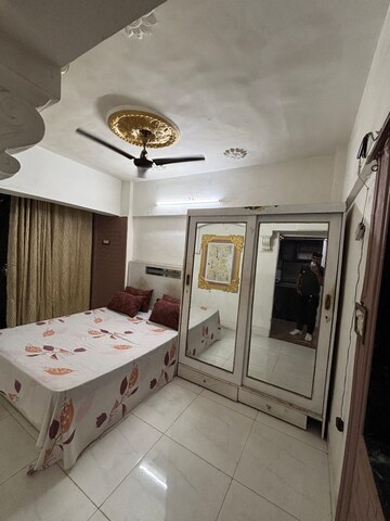 Bedroom in 2 BHK Apartment at Golds Green Apartment, Andheri West – for Rent