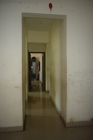 Building Lobby in 2 BHK Apartment at Rukmini Garden, Titwala – for Sale