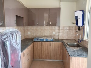 Kitchen in 2 BHK Apartment at Gaur 14th Avenue High Street, Sector 16c Greater Noida – for Sale