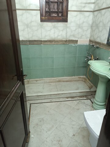Bathroom in 3 BHK Builder Floor at Yojna Vihar – for Rent