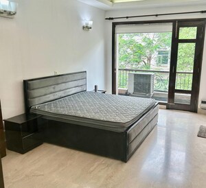 Bedroom in 4 BHK Builder Floor at Kalkaji – for Rent