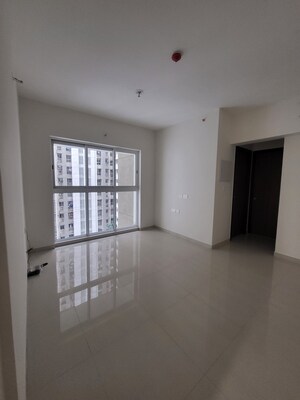 Living Room in 1 BHK Apartment at Lodha Amara, Kolshet Road – for Rent