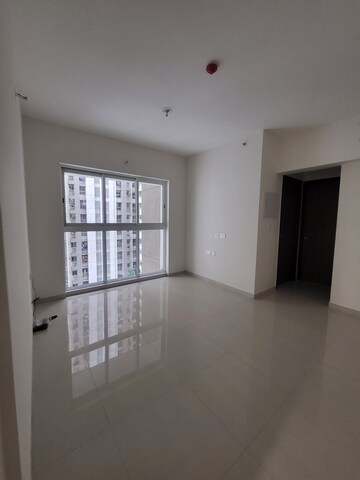 Living Room in 1 BHK Apartment at Lodha Amara, Kolshet Road – for Rent