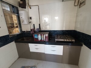 Kitchen in 1 BHK Apartment at Bindra Complex, Andheri East – for Rent