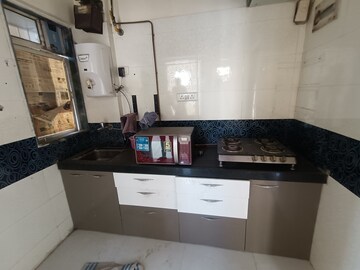 Kitchen in 1 BHK Apartment at Bindra Complex, Andheri East – for Rent
