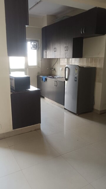 Kitchen in 2 BHK Apartment at Aims Golf City, Sector 75 – for Rent