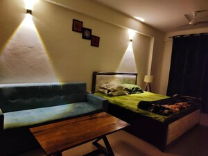 Living Room in 1 RK Apartment at Urbtech Xaviers, Sector 168 – for Rent