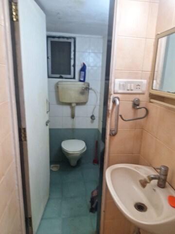 Bathroom in 2 BHK Apartment at Rajgir CHS, Andheri East – for Rent