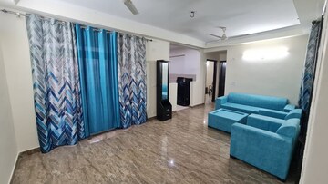 Living Room in Studio Apartment at Amrapali Princely Estate, Sector 76 – for Rent