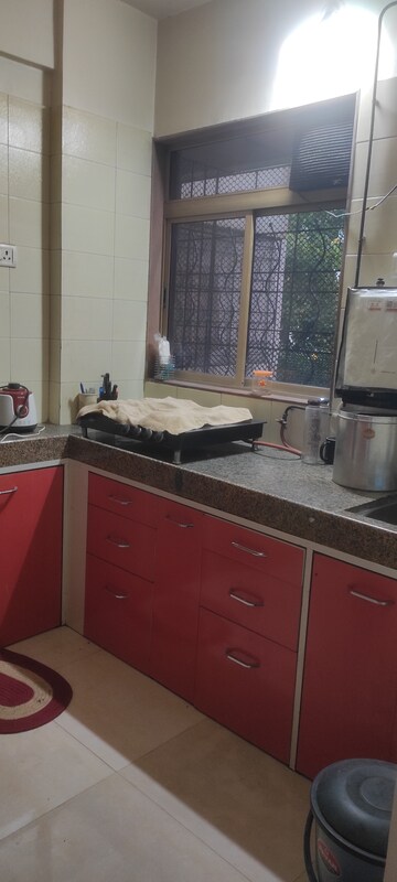 Kitchen in 2 BHK Apartment at Charms Residency CHS, Brahmand – for Sale