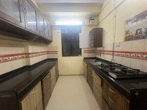 Kitchen in 3 BHK Apartment at Harmony Sky Suites, Ghodbunder Road – for Rent