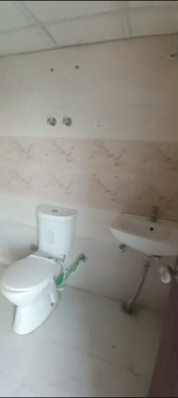 Bathroom in 2 BHK Apartment at Charms Castle, Raj Nagar Extension – for Rent