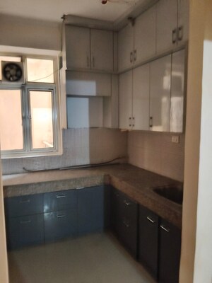 Kitchen in 2 BHK Apartment at Amrapali Golf Homes, Sector 4 Greater Noida – for Rent