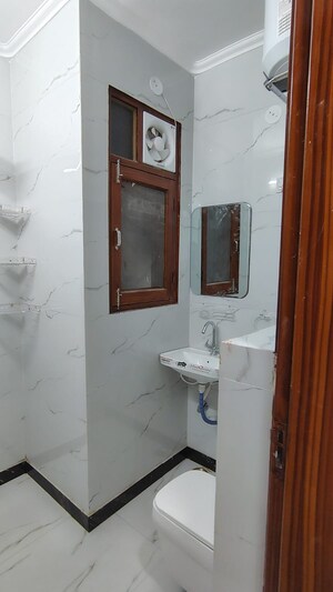 Bathroom in 3 BHK Builder Floor at Dwarka Mor – for Rent