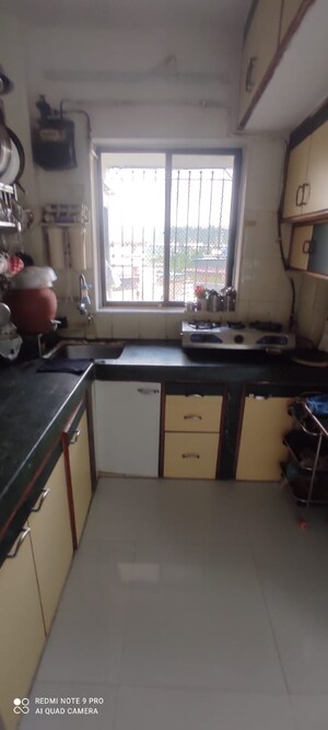 Kitchen in 1 BHK Apartment at Seawoods Sector 50 – for Sale