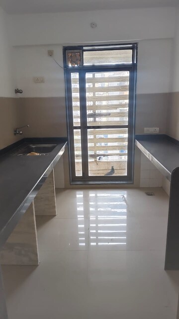 Kitchen in 2 BHK Apartment at Omkar Om Residency, Parel – for Sale