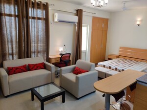 Living Room in 1 RK Apartment at Supertech Czar Suites, Omicron I Greater Noida – for Sale