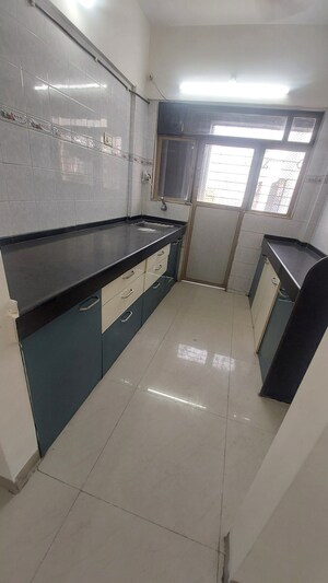 Kitchen in 2 BHK Apartment at Charkop Kesar CHS, Kandivali West – for Rent