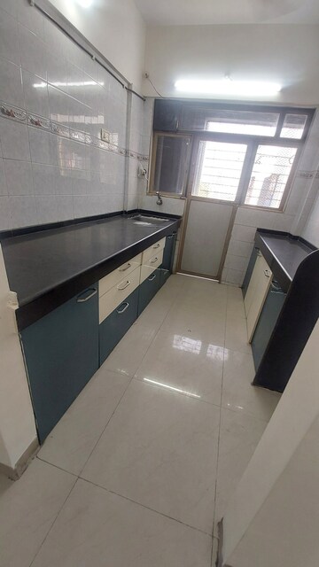 Kitchen in 2 BHK Apartment at Charkop Kesar CHS, Kandivali West – for Rent