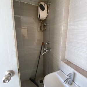 Bathroom in 1.5 BHK Apartment at Runwal Gardens Phase 2, Kalyan Shilphata Road – for Rent