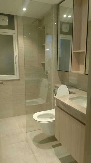 Bathroom in 3.5 BHK Builder Floor at DLF Gardencity Enclave, Sector 93 – for Rent
