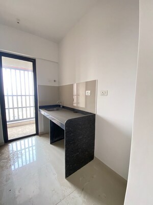 Kitchen in 1 BHK Apartment at Lodha Palava Downtown, Dombivli East – for Sale