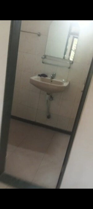 Bathroom in 2 BHK Apartment at Takshila CHS, Andheri East – for Rent