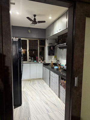 Kitchen in 2 BHK Apartment at Crystal Garden Estate CHS, Manpada – for Rent