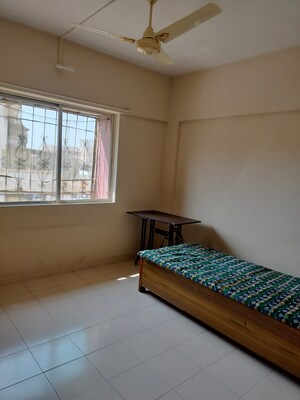 Bedroom in 2 BHK Apartment at Laxmi Nagar Society, Dhanori – for Rent