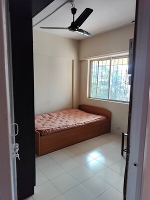 Bedroom in 2 BHK Apartment at Laxmi Nagar Society, Dhanori – for Rent