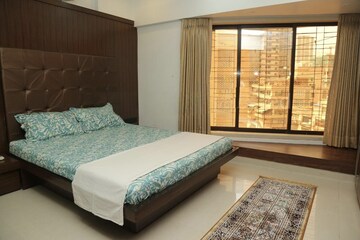 Bedroom in 3 BHK Apartment at Dheeraj Gaurav Heights, Jogeshwari West – for Rent