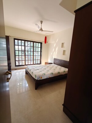 Bedroom in 2 BHK Apartment at Eken Heights, Khar West – for Rent