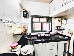 Kitchen in 1 BHK Apartment at Balkum Pada – for Sale