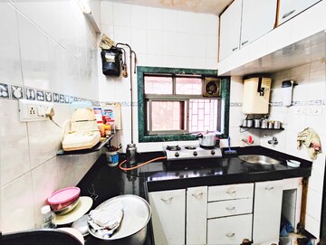 Kitchen in 1 BHK Apartment at Balkum Pada – for Sale