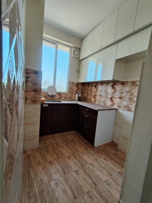 Kitchen in 2 BHK Apartment at Amrapali Golf Homes, Sector 4 Greater Noida – for Rent