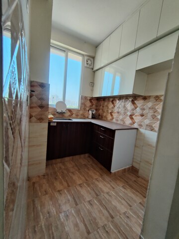 Kitchen in 2 BHK Apartment at Amrapali Golf Homes, Sector 4 Greater Noida – for Rent