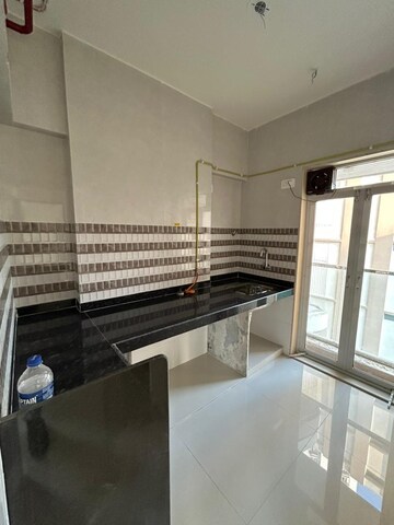 Kitchen in 1 BHK Apartment at JVM Corner Stone, Naupada – for Sale
