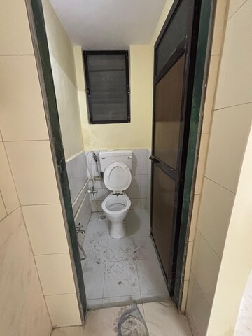 Bathroom in 1 BHK Apartment at Mandakini CHS, Dahisar East – for Rent