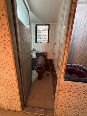 Bathroom in 1 BHK Apartment at Panorama Park, Dahisar East – for Rent