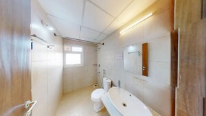 Bathroom in 2 BHK Apartment at Bhartiya Nikoo Homes, Thanisandra Main Road – for Sale