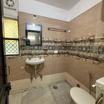 Bathroom in 2 BHK Builder Floor at Kalkaji – for Rent