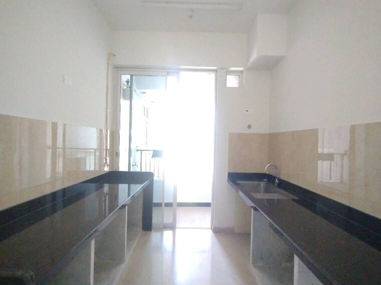 Kitchen, courtyard-by-narang-realty-and-the-wadhwa-group 2 Bedroom 840 Sq.Ft. Apartment In Pokhran Road No Two Thane 9510318