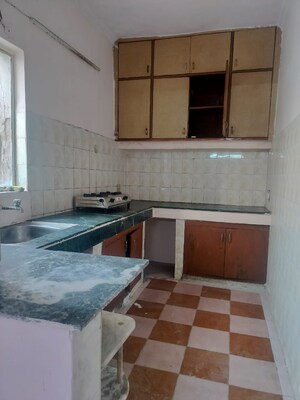 Kitchen in 2.5 BHK Apartment at RWA Jalvayu Vihar, Sector 25 – for Rent