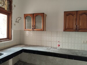 Kitchen in 2 BHK Apartment at Saffron Kanishka Tower, Sector 34 – for Rent