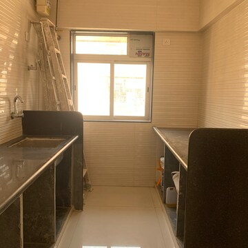 Kitchen in 1 BHK Apartment at Glasswood Om Sarjan CHSL, Dalvi Nagar – for Sale