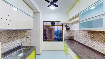 Kitchen in 5 BHK Apartment at Omkar Alta Monte, Malad East – for Sale