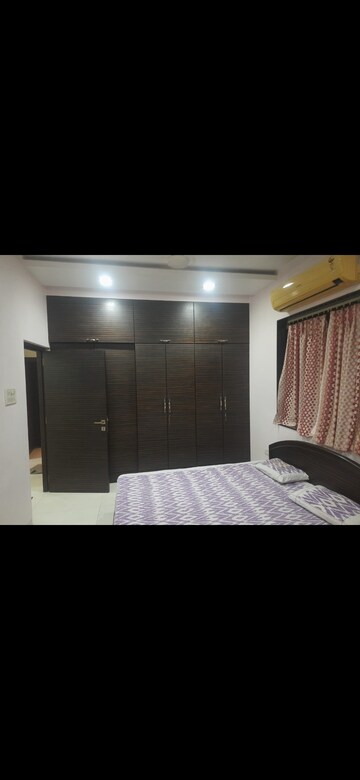Bedroom in 2 BHK Apartment at Yashovardhan Society, Mahim – for Rent