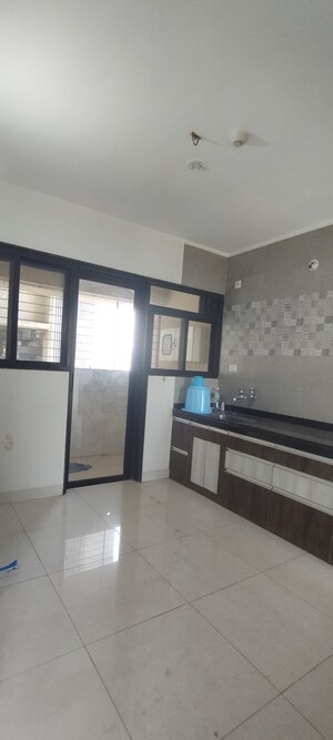 Kitchen in 2.5 BHK Apartment at Sargam CHS Nanded, Sinhagad Road – for Rent
