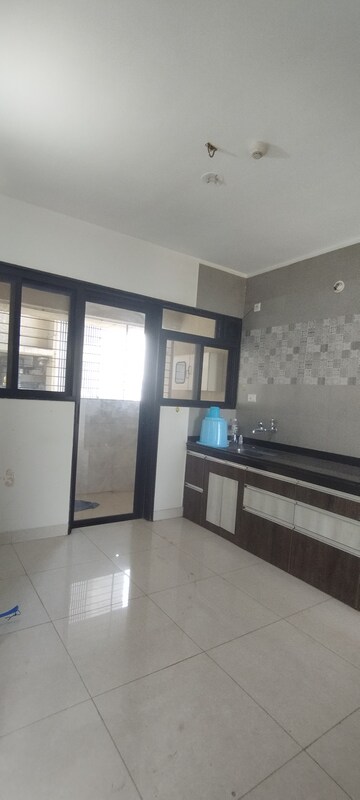 Kitchen in 2.5 BHK Apartment at Sargam CHS Nanded, Sinhagad Road – for Rent