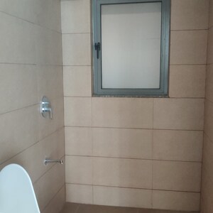 Bathroom in 1 BHK Apartment at Raunak Unnathi Woods Phase 4 And 5, Ghodbunder Road – for Sale